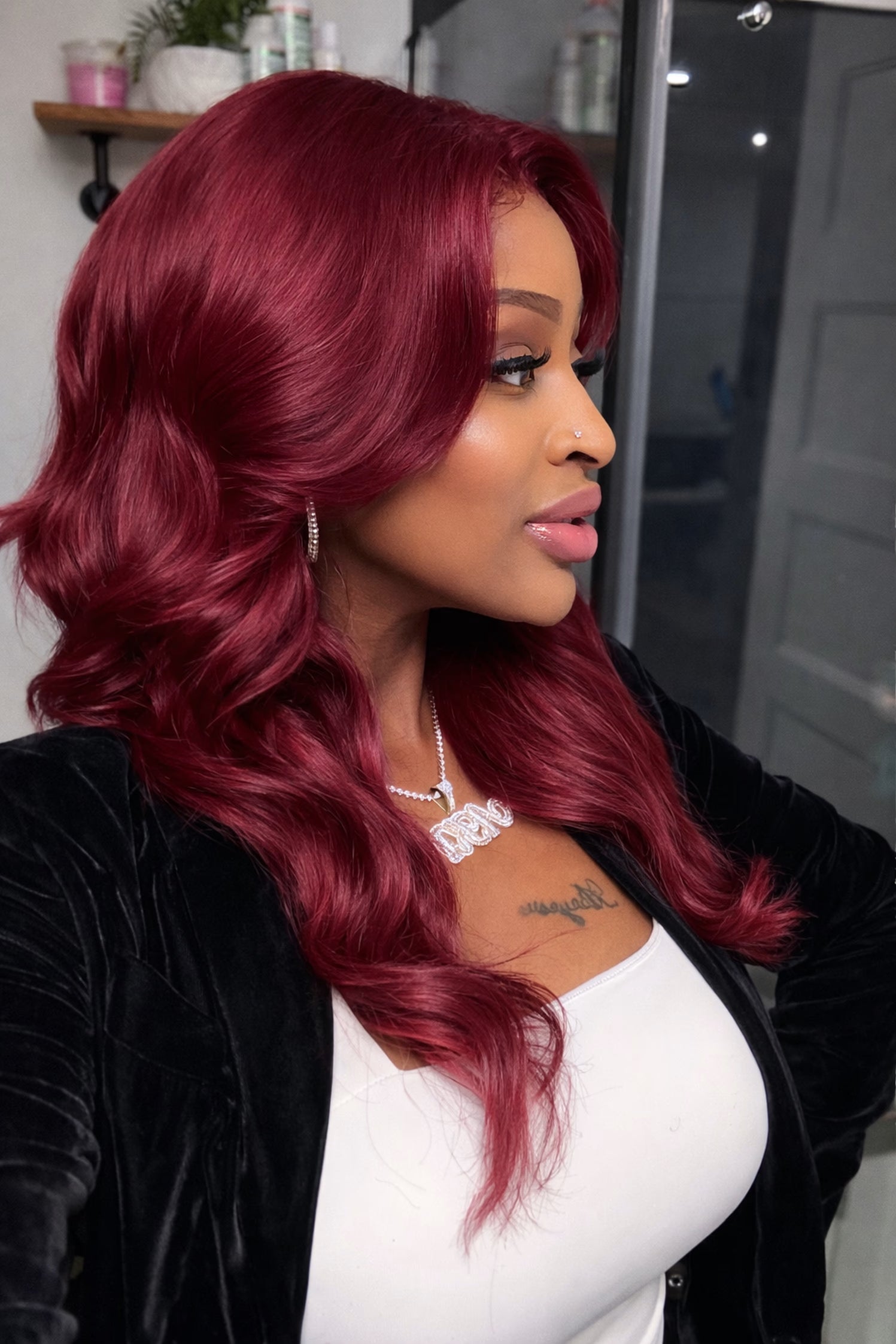Woman with vibrant red hair in a salon setting